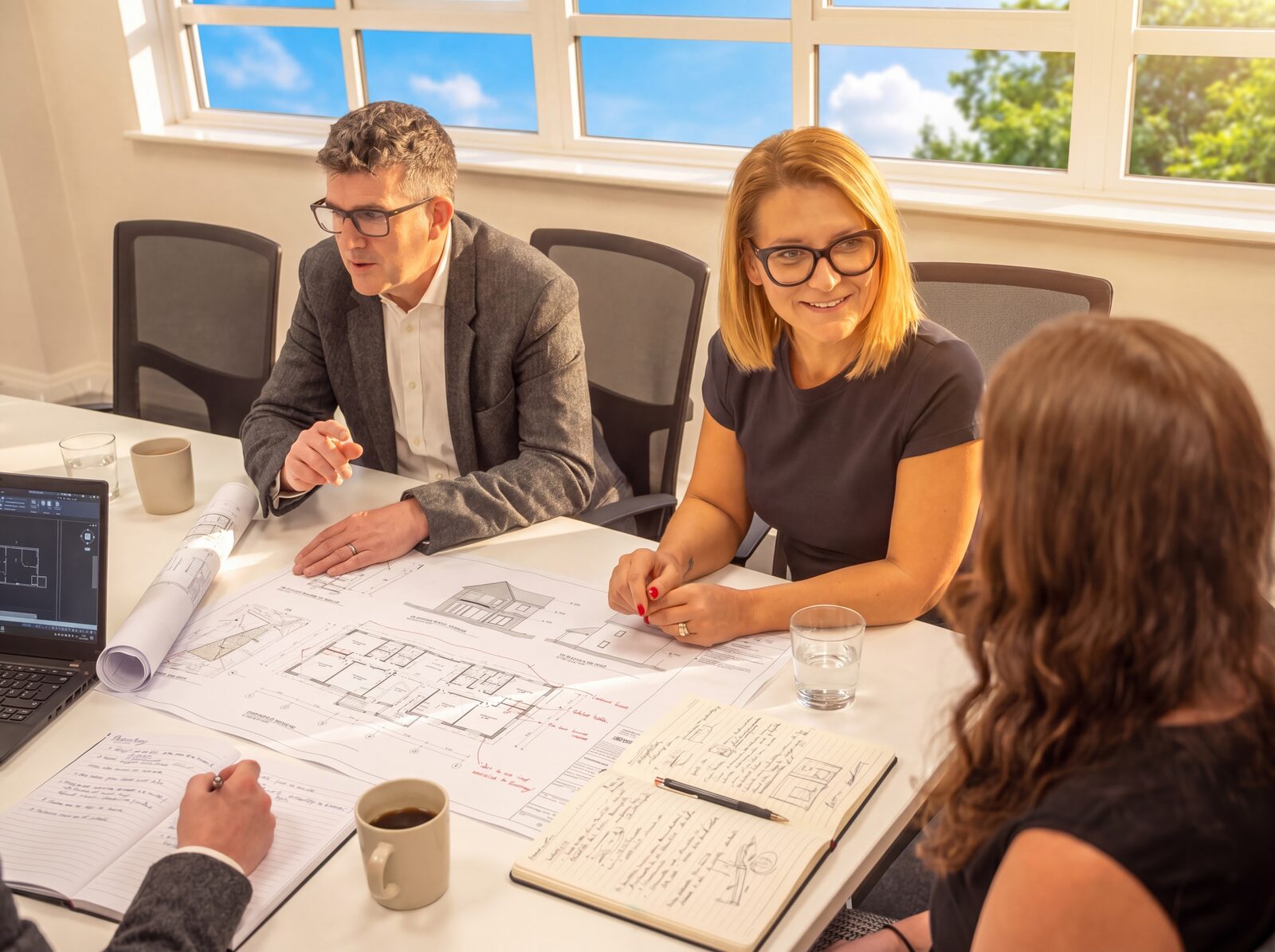 Iesis Structures team reviewing structural plans in the office